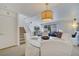 Bright dining area with a round glass table and white chairs, near the kitchen at 11886 Nautica Dr, Orlando, FL 32827