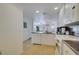 White kitchen with granite countertops and stainless steel appliances at 11886 Nautica Dr, Orlando, FL 32827
