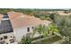 Spanish-style home with tile roof, landscaping, and walkway at 11886 Nautica Dr, Orlando, FL 32827