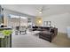 Spacious living room with a large sectional sofa and access to a patio at 11886 Nautica Dr, Orlando, FL 32827