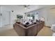 Bright living room featuring a large sectional sofa and sliding doors to a patio at 11886 Nautica Dr, Orlando, FL 32827
