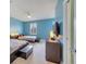 Blue bedroom with two twin beds, a TV, and a window at 11886 Nautica Dr, Orlando, FL 32827