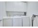 Laundry room with washer, dryer, and cabinets at 11886 Nautica Dr, Orlando, FL 32827