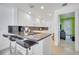 Kitchen with white cabinets, granite countertops, and a breakfast bar at 11886 Nautica Dr, Orlando, FL 32827