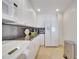 Modern kitchen with white cabinets, granite countertops, and stainless steel appliances at 11886 Nautica Dr, Orlando, FL 32827