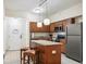 Kitchen with island and stainless steel appliances at 12527 Floridays Resort Dr # 312-E, Orlando, FL 32821