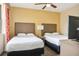 Bedroom with two double beds and a TV at 12527 Floridays Resort Dr # 312-E, Orlando, FL 32821