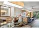 Modern condo dining area, glass table with seating for four and open floor plan at 12527 Floridays Resort Dr # 312-E, Orlando, FL 32821