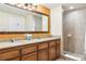 Bathroom with double vanity and shower at 12527 Floridays Resort Dr # 312-E, Orlando, FL 32821