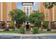 Condo building exterior with landscaping and parking at 12527 Floridays Resort Dr # 312-E, Orlando, FL 32821