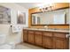 Double vanity bathroom with large mirror at 12527 Floridays Resort Dr # 312-E, Orlando, FL 32821
