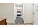 Hallway view with bedroom and flooring detail at 12527 Floridays Resort Dr # 312-E, Orlando, FL 32821