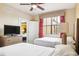 Bedroom with two double beds, TV, and window at 12527 Floridays Resort Dr # 312-E, Orlando, FL 32821