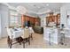 Modern kitchen with wood cabinets and breakfast bar at 1257 Radiant St, Reunion, FL 34747