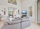 Spacious living room with large sectional sofa and high ceilings at 1257 Radiant St, Reunion, FL 34747