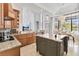 Spacious kitchen with granite island, breakfast nook, and view to backyard at 1257 Radiant St, Reunion, FL 34747