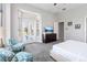 Serene Primary bedroom with access to patio, and plenty of natural light at 1257 Radiant St, Reunion, FL 34747