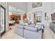 Open living space with gray sectional and views to kitchen at 1257 Radiant St, Reunion, FL 34747