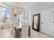 Elegant dining room with large windows, chandelier, and spacious table at 1257 Radiant St, Reunion, FL 34747