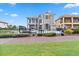 Grand two-story home with landscaped yard and brick pathway at 1257 Radiant St, Reunion, FL 34747