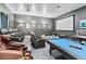 Home theater and game room with comfortable seating at 1257 Radiant St, Reunion, FL 34747