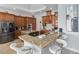 Modern kitchen with granite counters, breakfast bar, and stainless steel appliances at 1257 Radiant St, Reunion, FL 34747