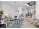 Spacious living room with a comfortable sofa, coffee table, and elegant rug at 1257 Radiant St, Reunion, FL 34747