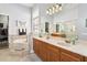 Elegant bathroom with a soaking tub, double vanity, and a walk-in shower at 1257 Radiant St, Reunion, FL 34747