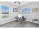 Home office with a modern desk setup and plenty of natural light at 1257 Radiant St, Reunion, FL 34747