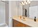 Simple bathroom with a single sink, bathtub, and updated fixtures at 1257 Radiant St, Reunion, FL 34747