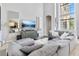 Spacious living room with large sectional sofa and big screen TV at 1257 Radiant St, Reunion, FL 34747