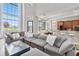 Spacious living room with large sectional sofa and high ceilings at 1257 Radiant St, Reunion, FL 34747