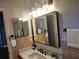 Bathroom with updated vanity, large mirror, and new lighting at 213 E Hillcrest St, Altamonte Springs, FL 32701