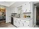 Updated kitchen with white cabinets and granite counters at 213 E Hillcrest St, Altamonte Springs, FL 32701