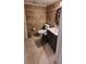 Bathroom with toilet, sink and dark brown vanity at 5826 Peregrine Ave # F01, Orlando, FL 32819