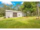 Large metal workshop with a roll-up door and plenty of space at 12151 Walker Pond Rd, Winter Garden, FL 34787