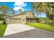 Single-story house with attached garage and screened porch at 12151 Walker Pond Rd, Winter Garden, FL 34787