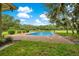 Refreshing in-ground pool and expansive lawn at 12151 Walker Pond Rd, Winter Garden, FL 34787