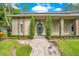 House exterior featuring a large front porch and landscaped yard at 12151 Walker Pond Rd, Winter Garden, FL 34787