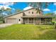 Single-story house with attached garage and screened porch at 12151 Walker Pond Rd, Winter Garden, FL 34787