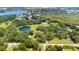 Aerial view showing home, pond, and landscape at 12151 Walker Pond Rd, Winter Garden, FL 34787