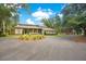 Two-story home with circular driveway and landscaping at 12151 Walker Pond Rd, Winter Garden, FL 34787