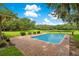Inviting in-ground pool with brick patio at 12151 Walker Pond Rd, Winter Garden, FL 34787