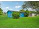 Cute blue house with a spacious lawn and fenced yard at 3034 Touraine Ave, Orlando, FL 32812