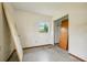 This small bedroom has speckled flooring and a closet at 3034 Touraine Ave, Orlando, FL 32812
