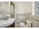 This bathroom has gray tile, a shower and vanity at 3034 Touraine Ave, Orlando, FL 32812