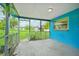 Bright blue screened porch overlooks backyard at 3034 Touraine Ave, Orlando, FL 32812