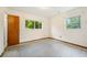 This bedroom includes speckled flooring and two windows at 3034 Touraine Ave, Orlando, FL 32812