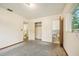 This bedroom has speckled flooring and en-suite bathroom access at 3034 Touraine Ave, Orlando, FL 32812