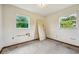 A bedroom with damaged walls and speckled flooring at 3034 Touraine Ave, Orlando, FL 32812